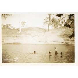 Swimmers in the river at the C.O.D. picnic, Alice River, Townsville, 1946