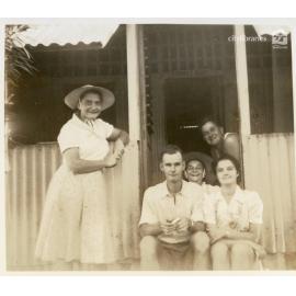 Group posing on a veranda, Townsville, ca. 1946