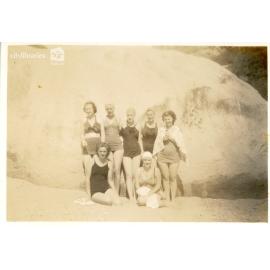 Group posing in front of a rock, [Magnetic Island], Townsville, ca. 1949
