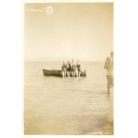 Group posing in front of a boat, [Magnetic Island], Townsville, ca. 1949