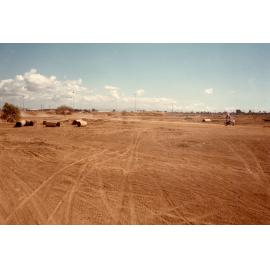 Proposed lake development area south of Woolcock Street with trail bike actvities in progress, Townsville, 1984