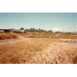 Floodgate on Woolcock canal viewed from Ross Creek, Townsville, 1984