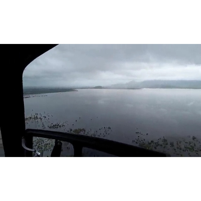 Flinders Highway Woodstock facing back to Ross River Dam, aerial footage during floods, 2019. 