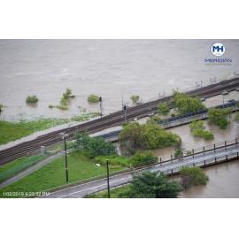 River level skirts under Rooney's Bridge, aerial photograph during floods, Oonoonba, 2019. 