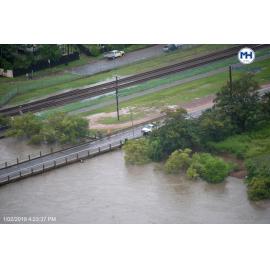 Road Worker Inspects Rooney's Bridge, aerial photograph during floods, 2019. 