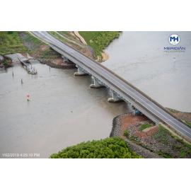 Southern Port Road bridge, old Pacific Marine Group barge unloading ramp, aerial photograph during floods, 2019. 