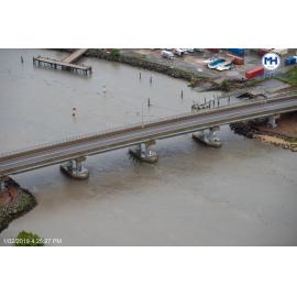 Southern Port Road bridge, old Pacific Marine Group barge unloading ramp, aerial photograph during floods, 2019. 