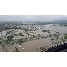 Stuart Drive, Townsville Velodrome, Gordon Creek, aerial photograph during floods, 2019