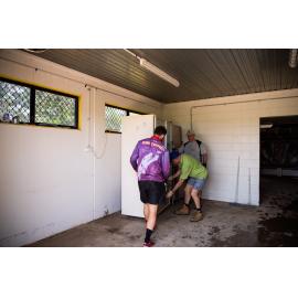 Hermit Park AFL Club volunteers removing flood damaged appliances, Hermit Park, 2019