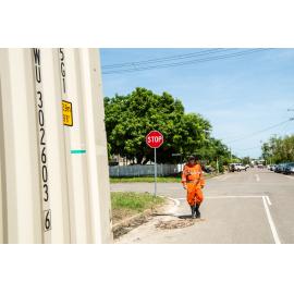 SES Volunteer walking down flood affected street, corner Campbells Street and Queens Road, Hermit Park, 2019