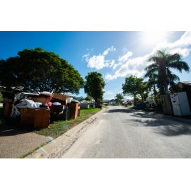 Damaged household goods lining streets of flood affected street, Idalia, 2019