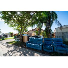 Damaged household goods lining streets of flood affected street, Idalia, 2019