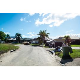 Damaged household goods lining streets of flood affected street, Idalia, 2019