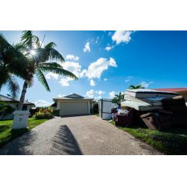 Damaged household goods lining streets of flood affected street, Idalia, 2019