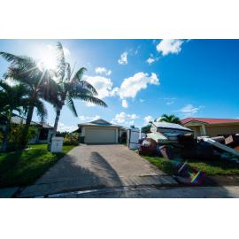 Damaged household goods lining streets of flood affected street, Idalia, 2019