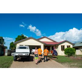 Residents/Volunteers standing in front of flood affected home, Idalia,  2019