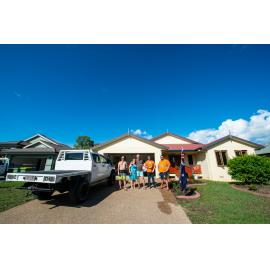 Residents/Volunteers standing in front of flood affected home, Idalia,  2019