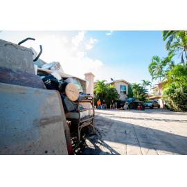 Home owners take a break during clean up, Rosslea, 2019.