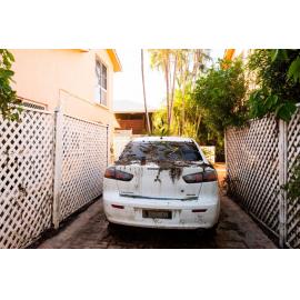 Debris and mud covers car from flood, Rosslea, 2019.