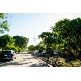 Flooded contents of homes piled up along street, Rosslea, 2019.