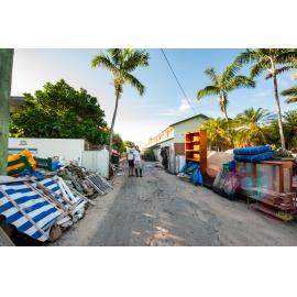 Couple outside home during clean up, Rosslea, 2019. 