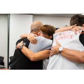 Mayor Jenny Hill  and Mike Chiodo embrace, Disaster Committee Meeting, 2019.
