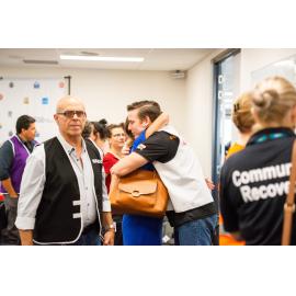 Cr Kurt Rehbein and Committee member embrace, Disaster Committee Meeting, 2019.