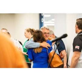Local Disaster Coordinator Wayne Preedy and member embrace, Disaster Committee Meeting, 2019.