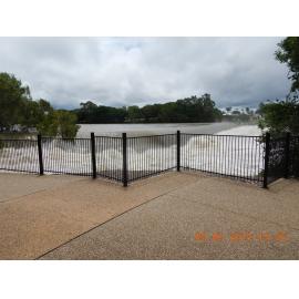 Flood waters spill over the Gleesons Weir, 2019. 