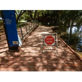 "Stop Here" sign at the Submerged Riverway boardwalk, 2019. 