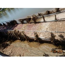 Submerged and debris covered Riverway boardwalk, 2019. 