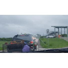 Cars lined up at Stuart dump to dispose of flood damaged goods, Stuart, 2019.