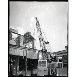 Demolition of the ambulance station, corner of Sturt and Stanley Street, Townsville City, Townsville, 8 September 1968