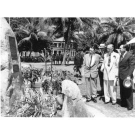 [Dr. R.A. Douglas, Captain J.B.M. Peto, Sir Henry Abel Smith and Alderman Angus Smith studying the memorial plaque, Anzac Park, Townsville, 1964]